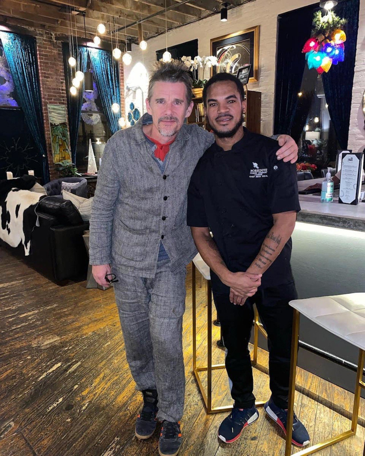  The Biscuit Lounge 
120 S. 10th St. 
Ethan Hawke with Chef Rico Vidal of The ForkDive Experience at the loft at The Biscuit Lounge.
Photo via Rico Vidal.